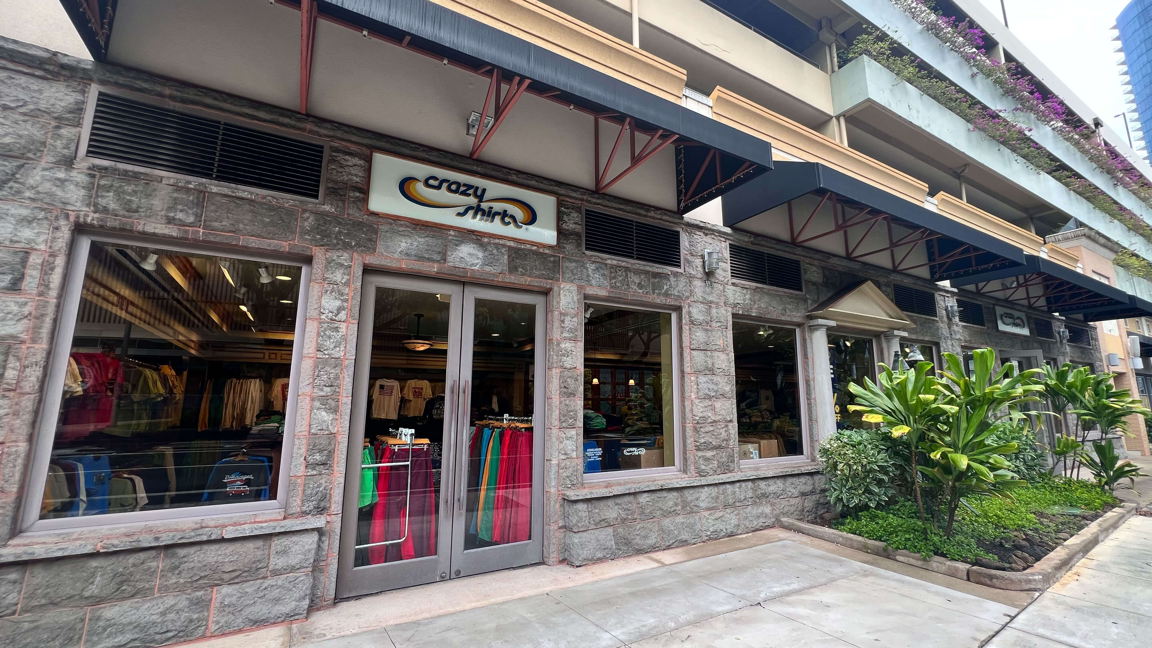 Ward Village Storefront with 'Crazy Shirts' sign and clothing displayed inside