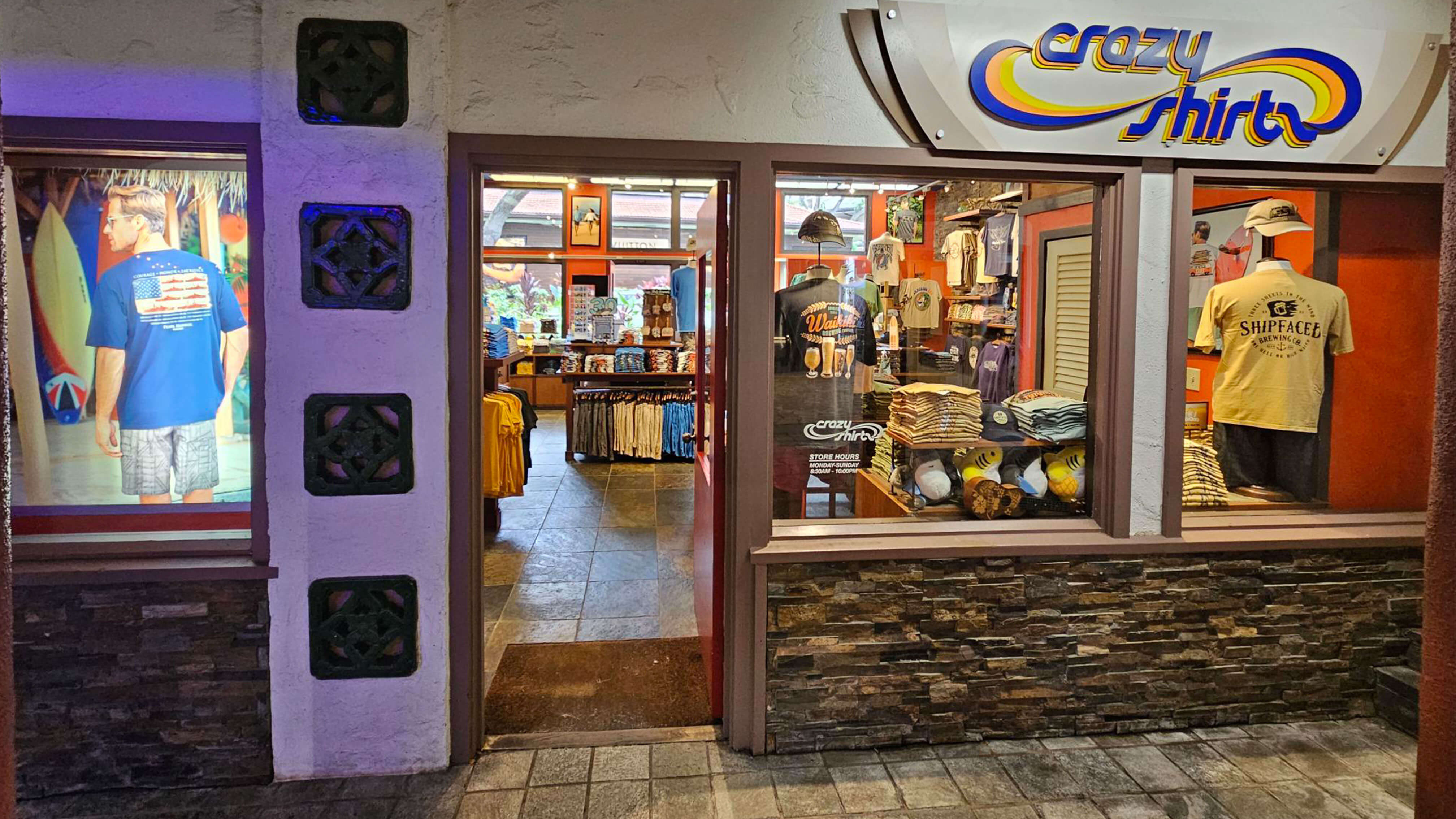 Hilton Hawaiian Village store interior with 'crazy shirts' sign and display of shirts.