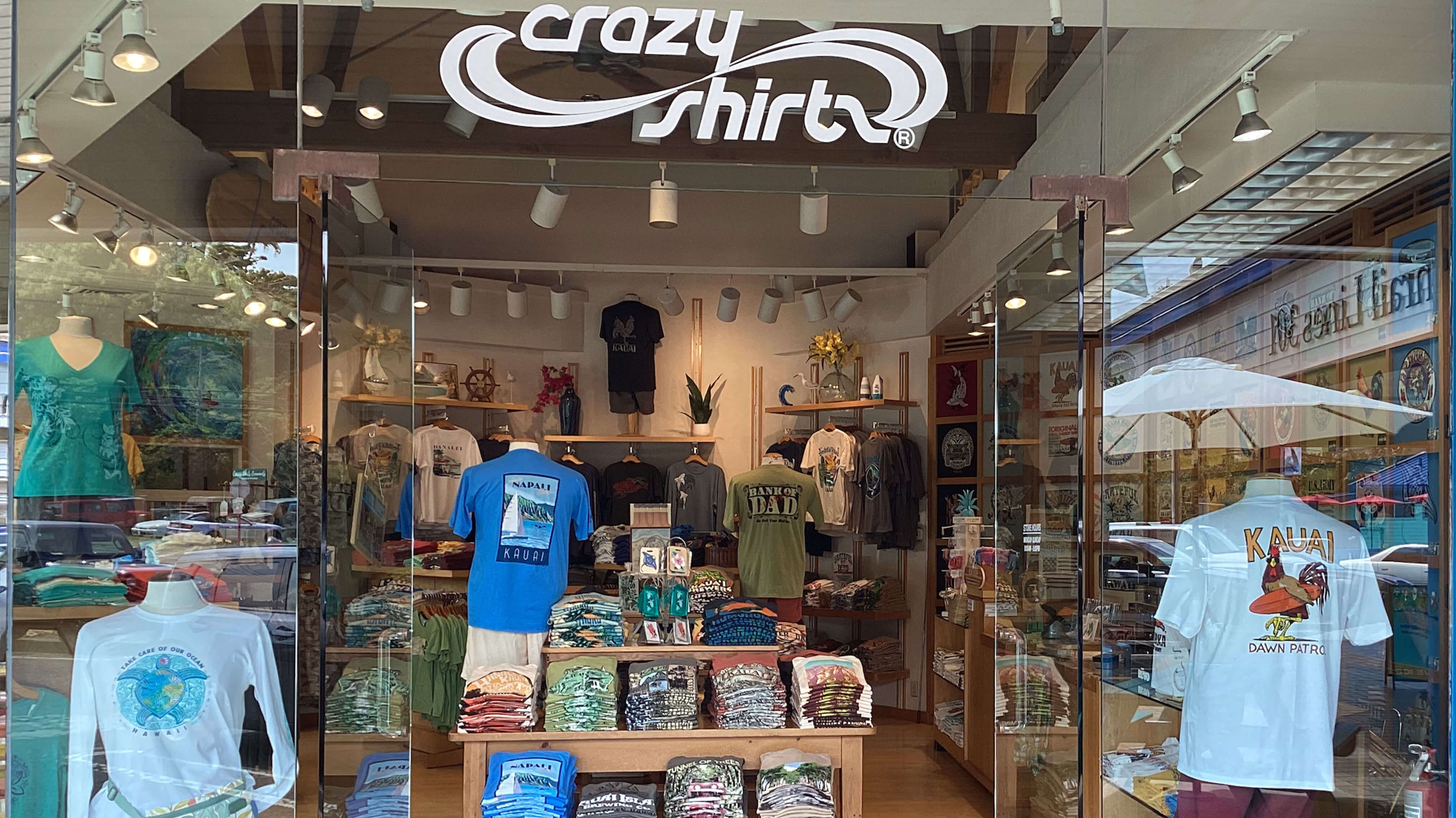Anchorage Cove store interior with 'crazy shirts' sign and display of clothing