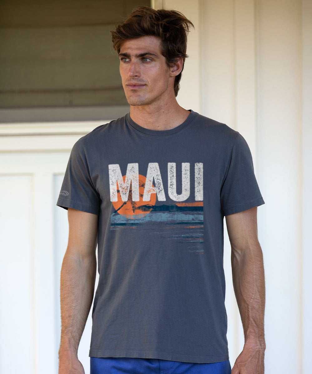 Man wearing a gray t-shirt with 'MAUI' printed on it, standing in front of a white wall. View 2