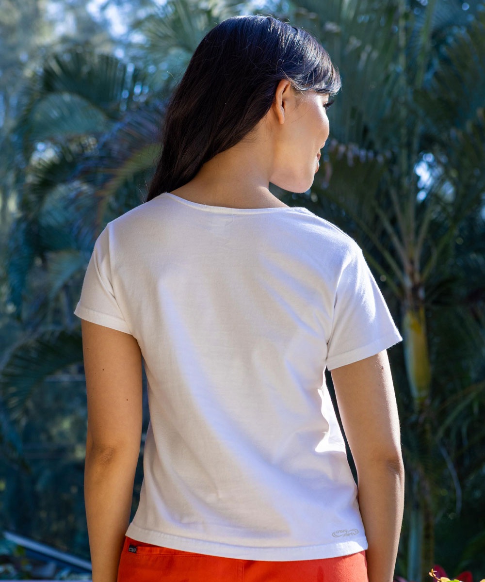 Person wearing a white t-shirt with a blurred natural background View 3