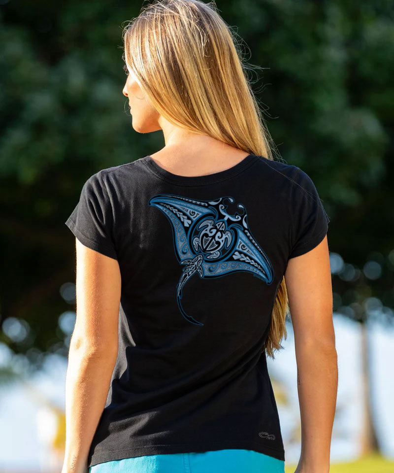 Woman wearing a black t-shirt with a blue manta ray design outdoors. View 2