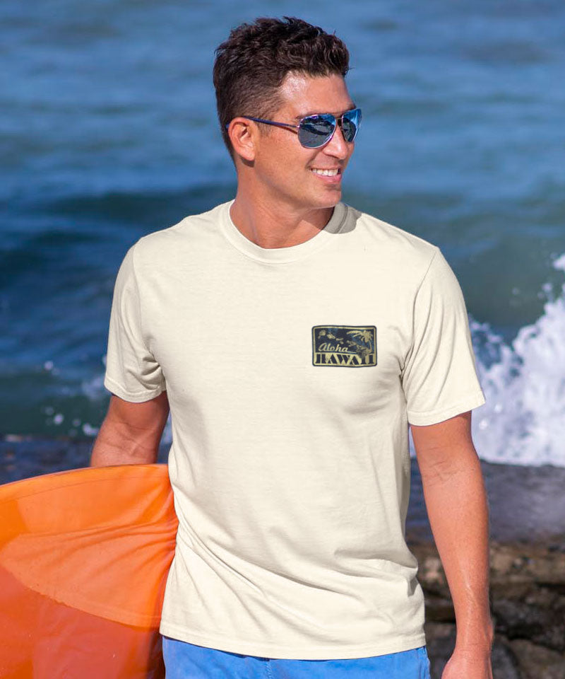 Man holding an orange surfboard at the beach View 3