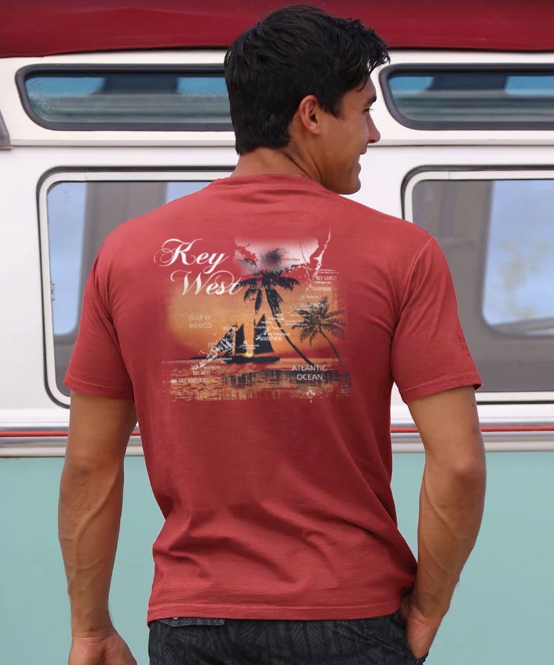Man wearing a red t-shirt with 'Key West' design, standing in front of a vintage van. View 2