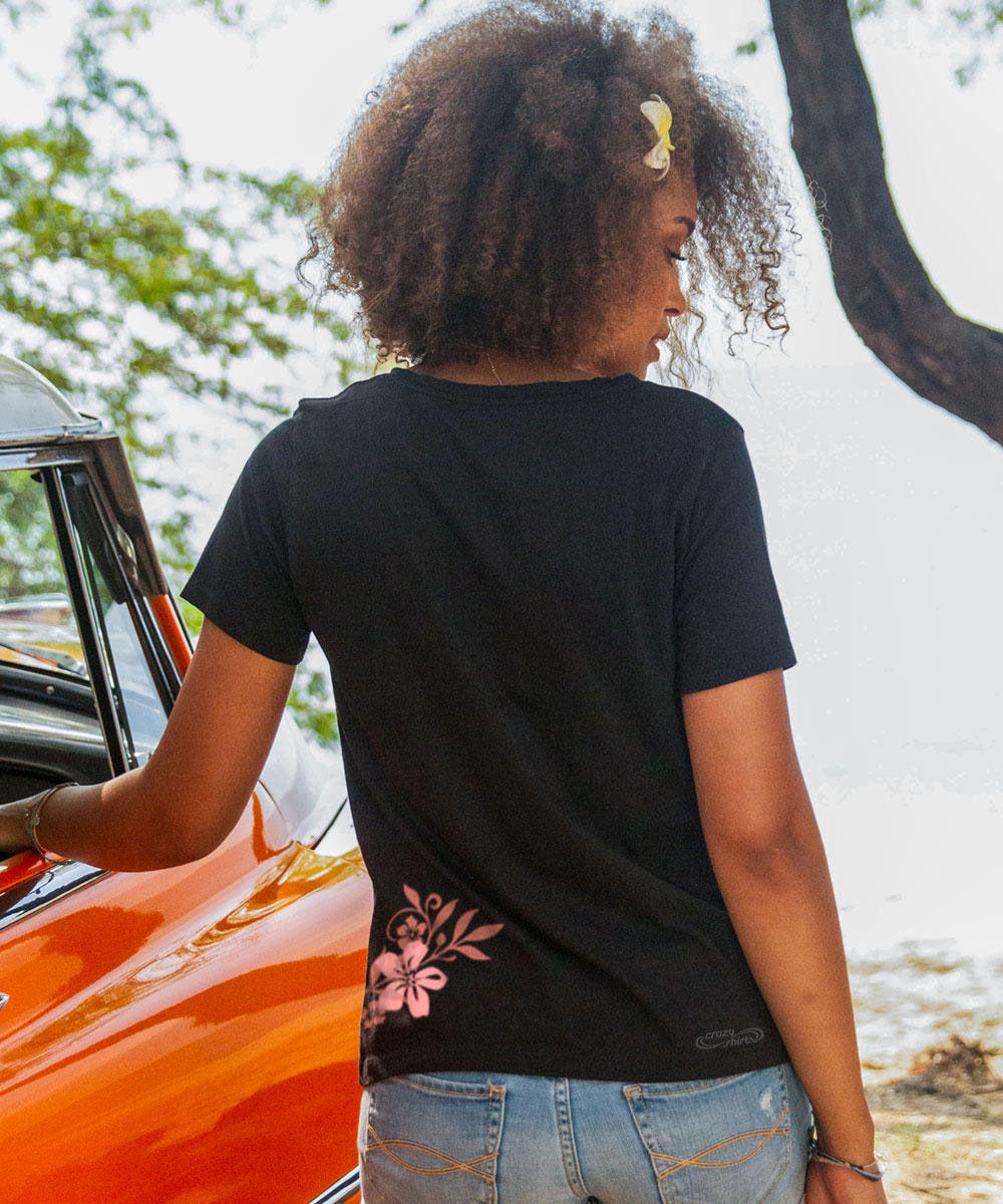 Woman wearing a black shirt standing next to a vintage car View 3