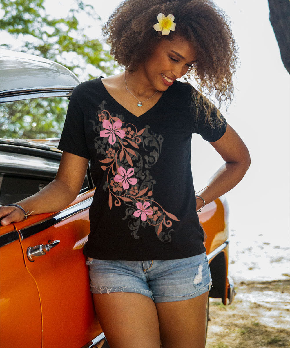 Woman wearing a black v-neck tee with a large floral design on the front View 2
