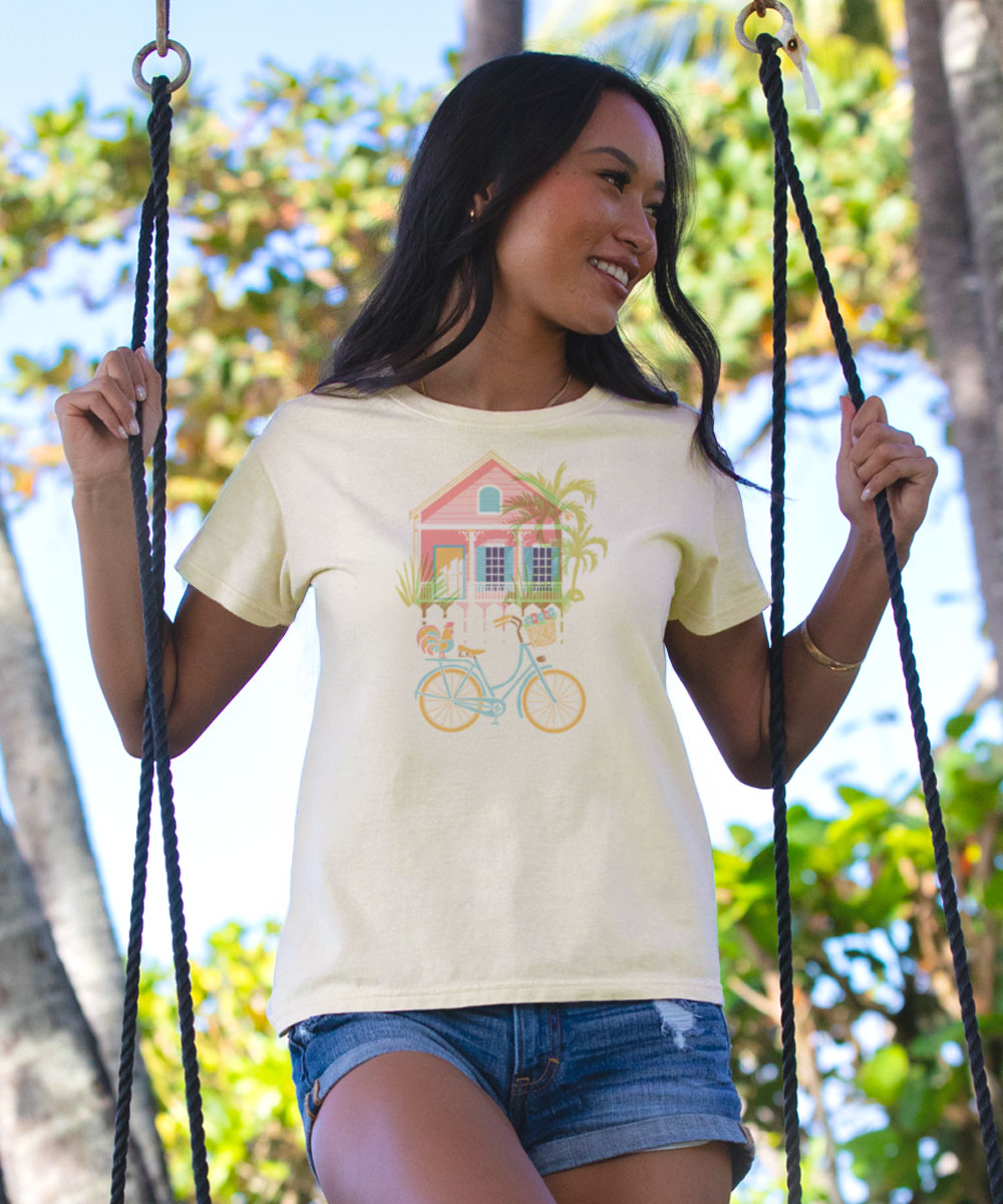 Woman on a swing wearing a t-shirt with a colorful house design View 2