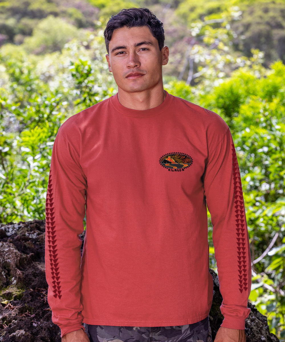Man in red long sleeve shirt standing in front of rocks and greenery View 3