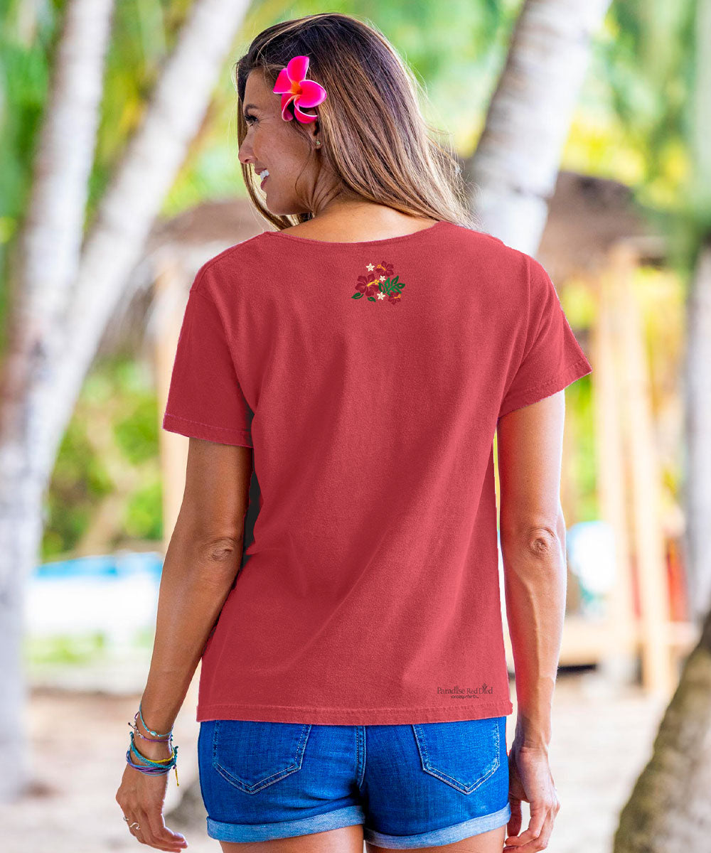 Woman wearing a red scoop neck tee with a small design on the back top of the tee View 3