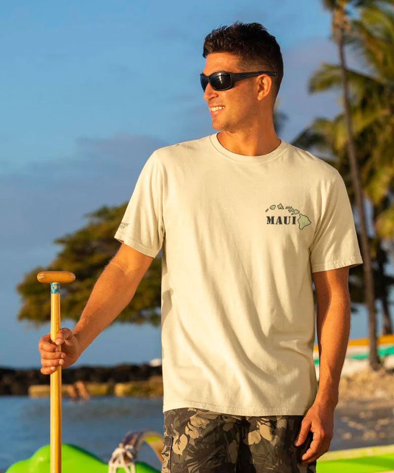 Man holding a paddle at the beach during sunset View 3