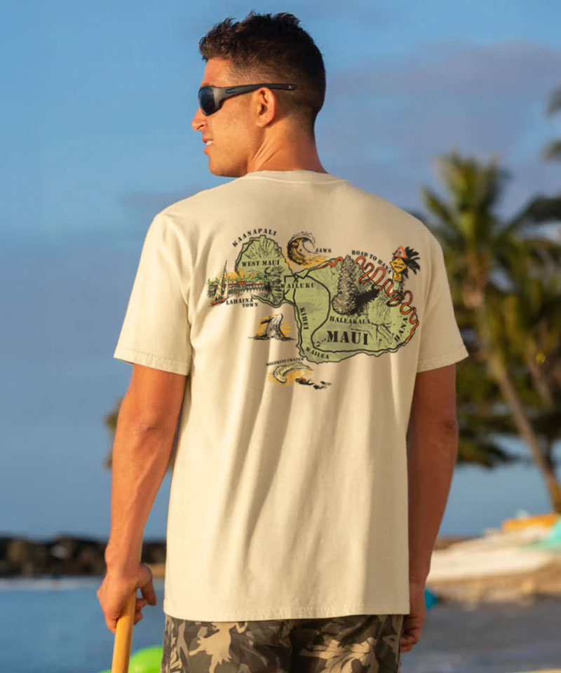 Man at the beach wearing a shirt with a design showing the island of 'MAUI' View 2