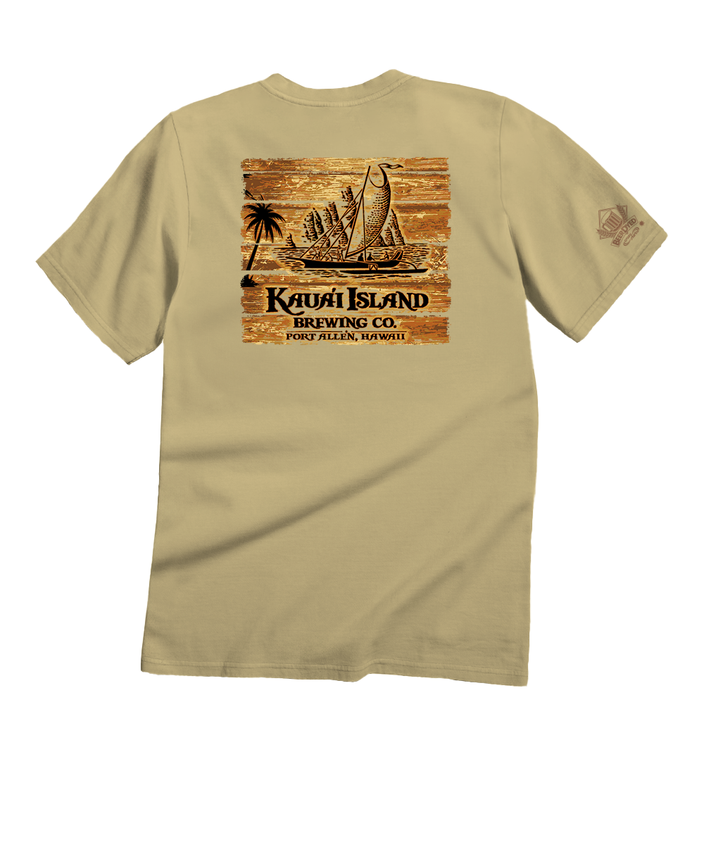 Beige t-shirt with a wooden sailboat design and text on the back, on a white background. View 1