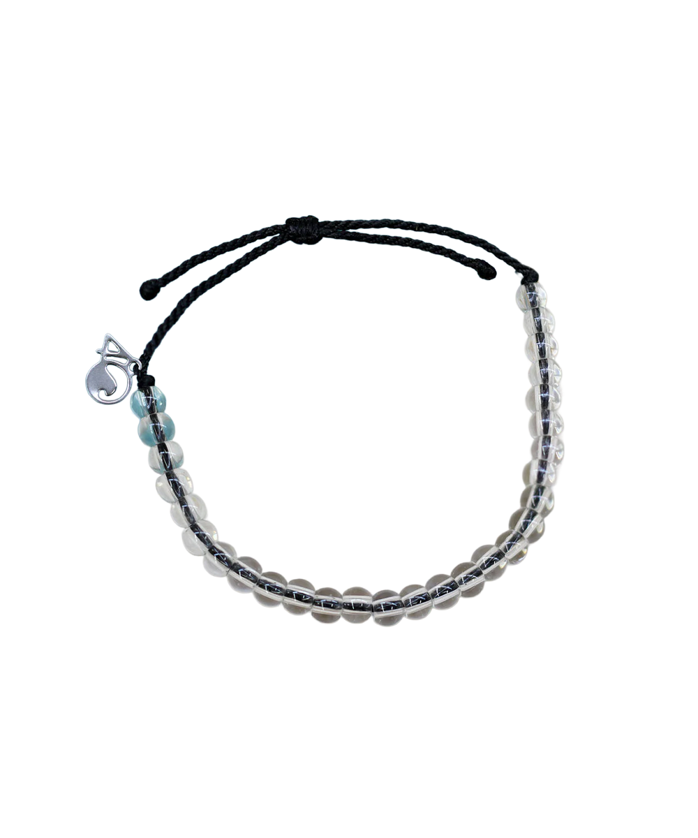 Beaded bracelet with a black cord on a white background