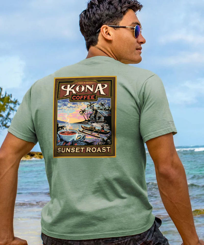 Man wearing a green t-shirt with Kona Coffee graphic on a beach View 2