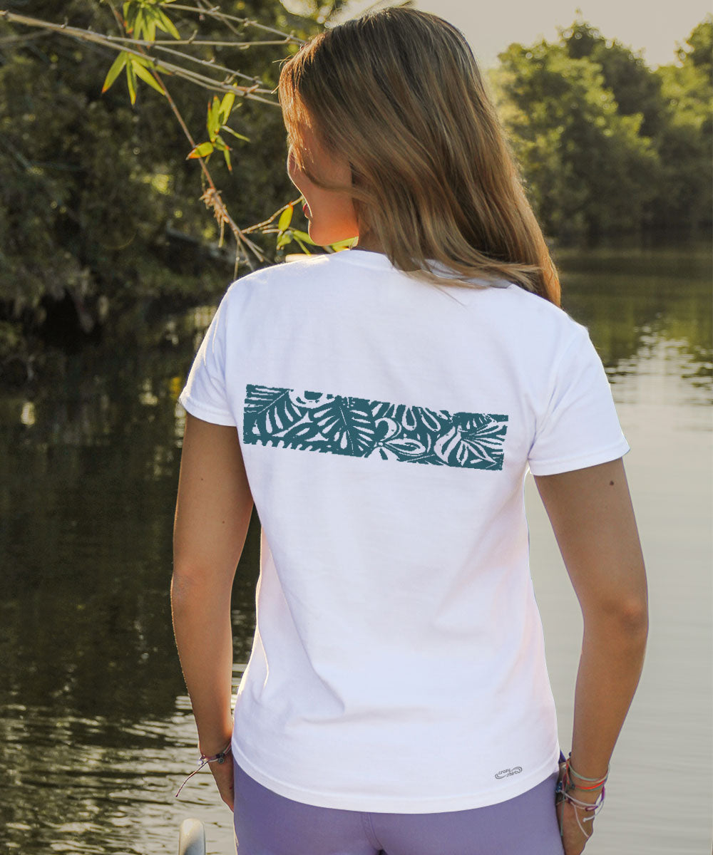 woman in white t shirt in front of water View 3