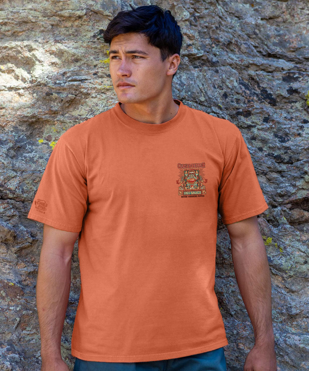 Man wearing brown t shirt standing in front of a rock View 3