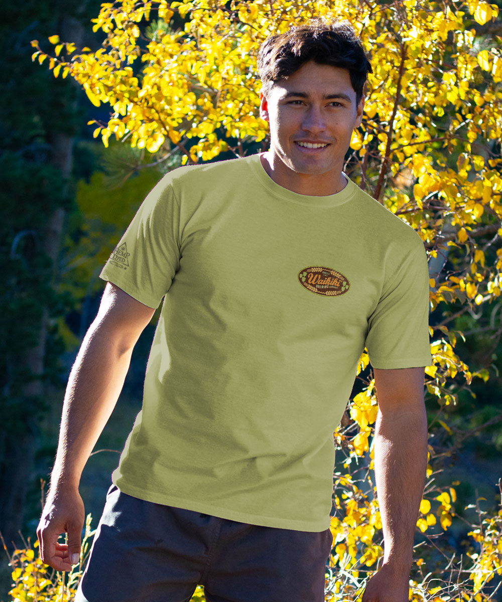 Man in a green colored shirt outside View 3