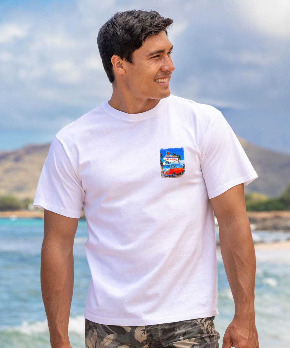 Man wearing a white t-shirt with a colorful graphic on a beach View 3