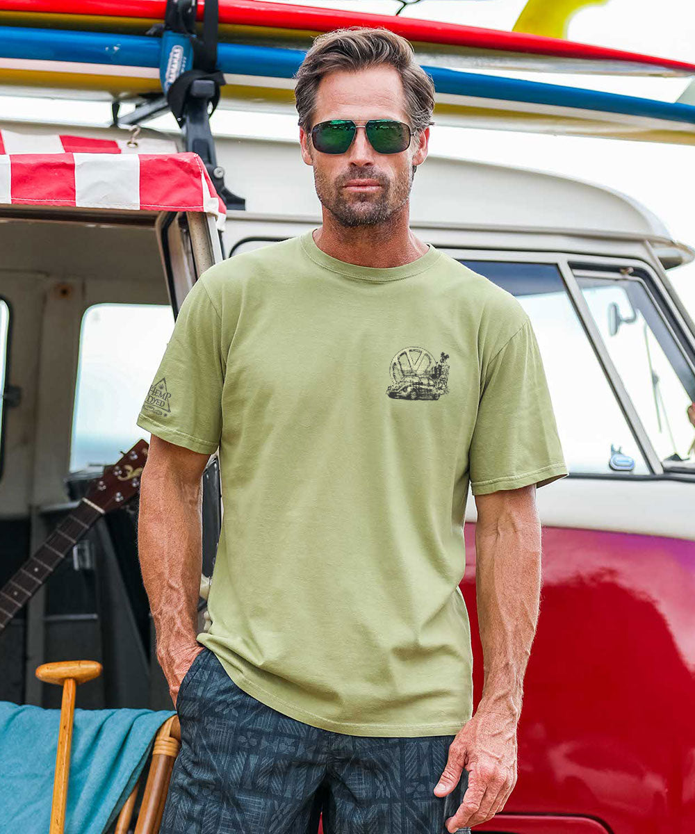 Man in olive green shirt standing in front of a van View 3