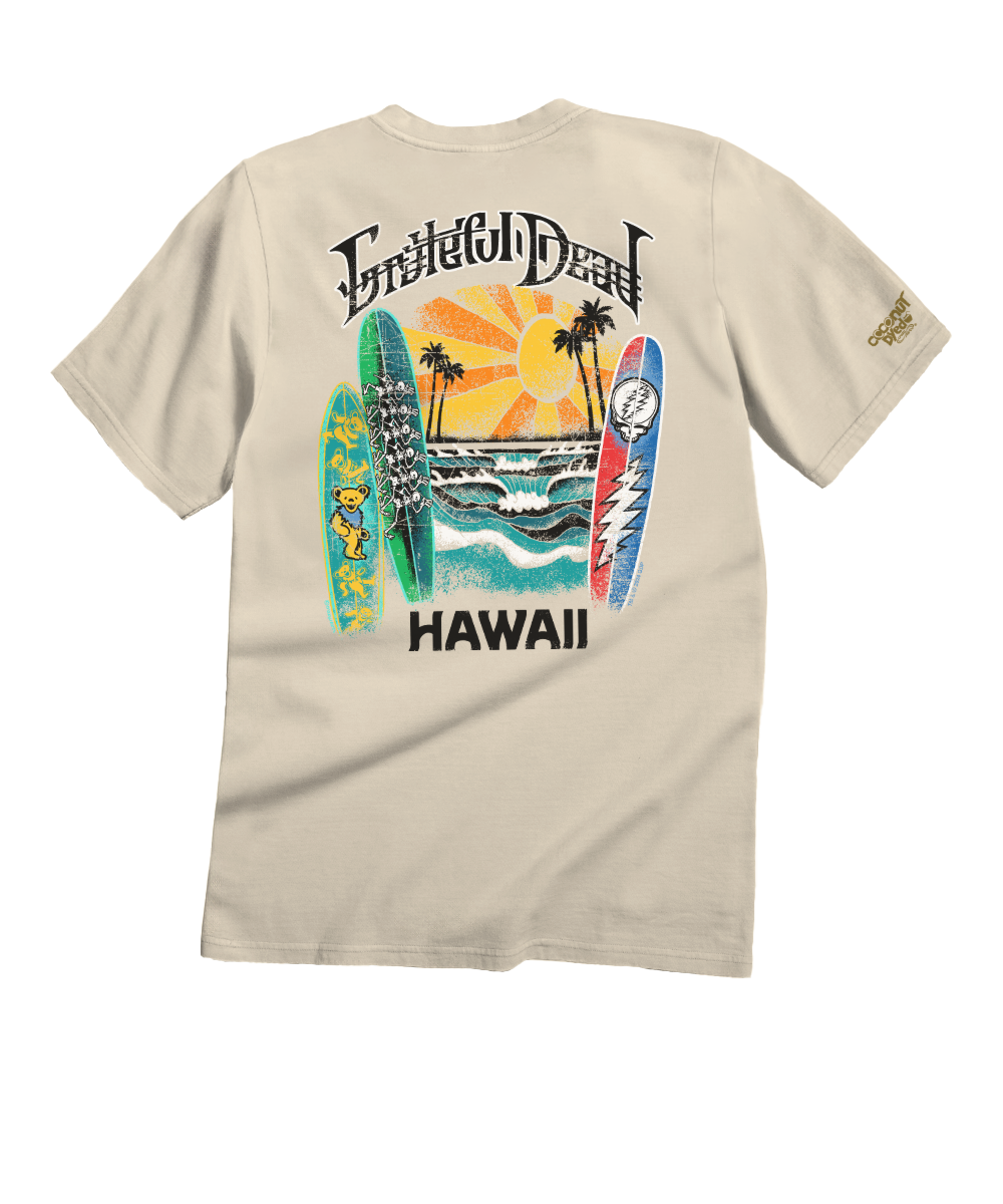 T-shirt with a graphic design of surfboards, palm trees, and a sunset on a beige background. View 1