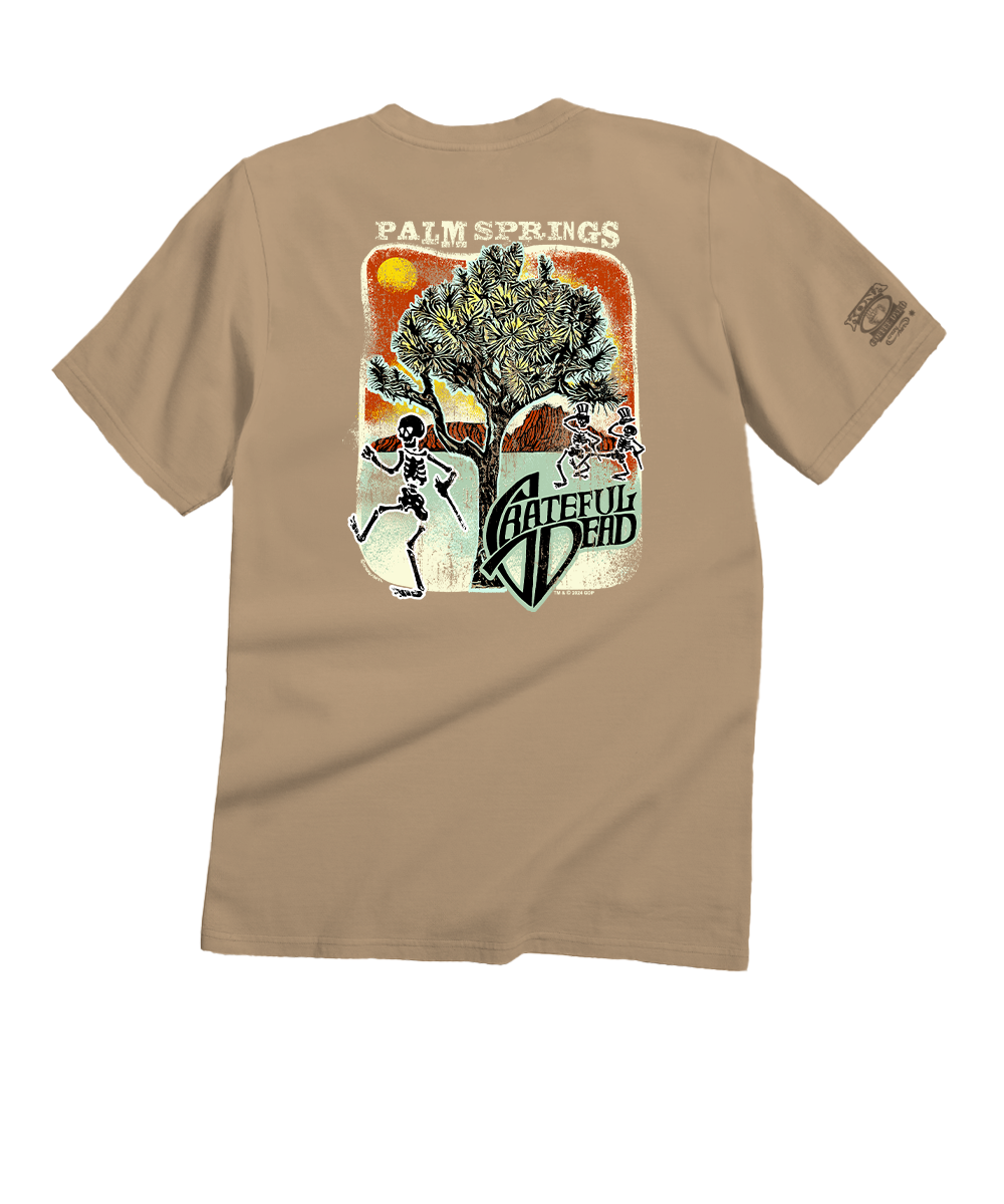 Beige t-shirt with a graphic design featuring a skeleton, tree, and text on a white background View 1