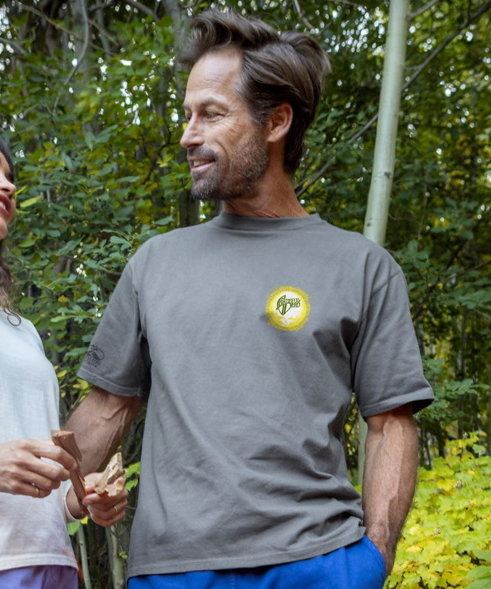 Man in grey t shirt talking to another person View 3