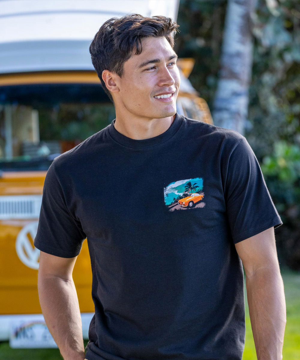 man in black t shirt in front of retro van View 3