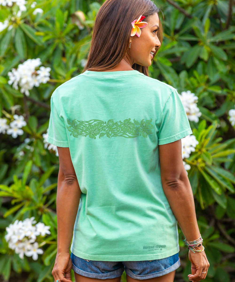 woman in light green t shirt with graphic on back standing outside View 3