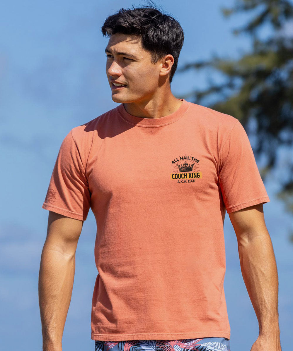 A man wearing a short sleeve shirt that says Couch King on it View 3