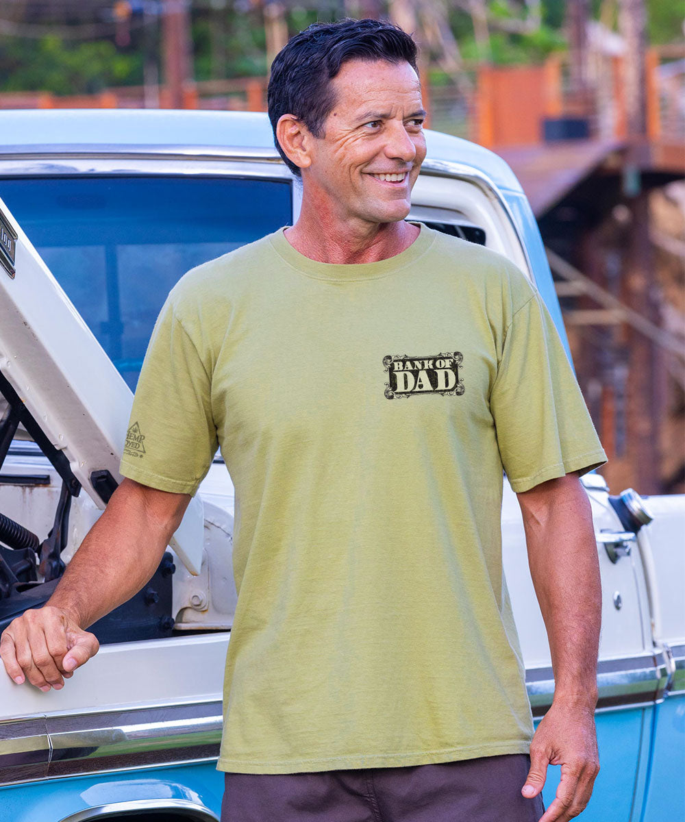 Man wearing green shirt that says Bank of Dad View 3