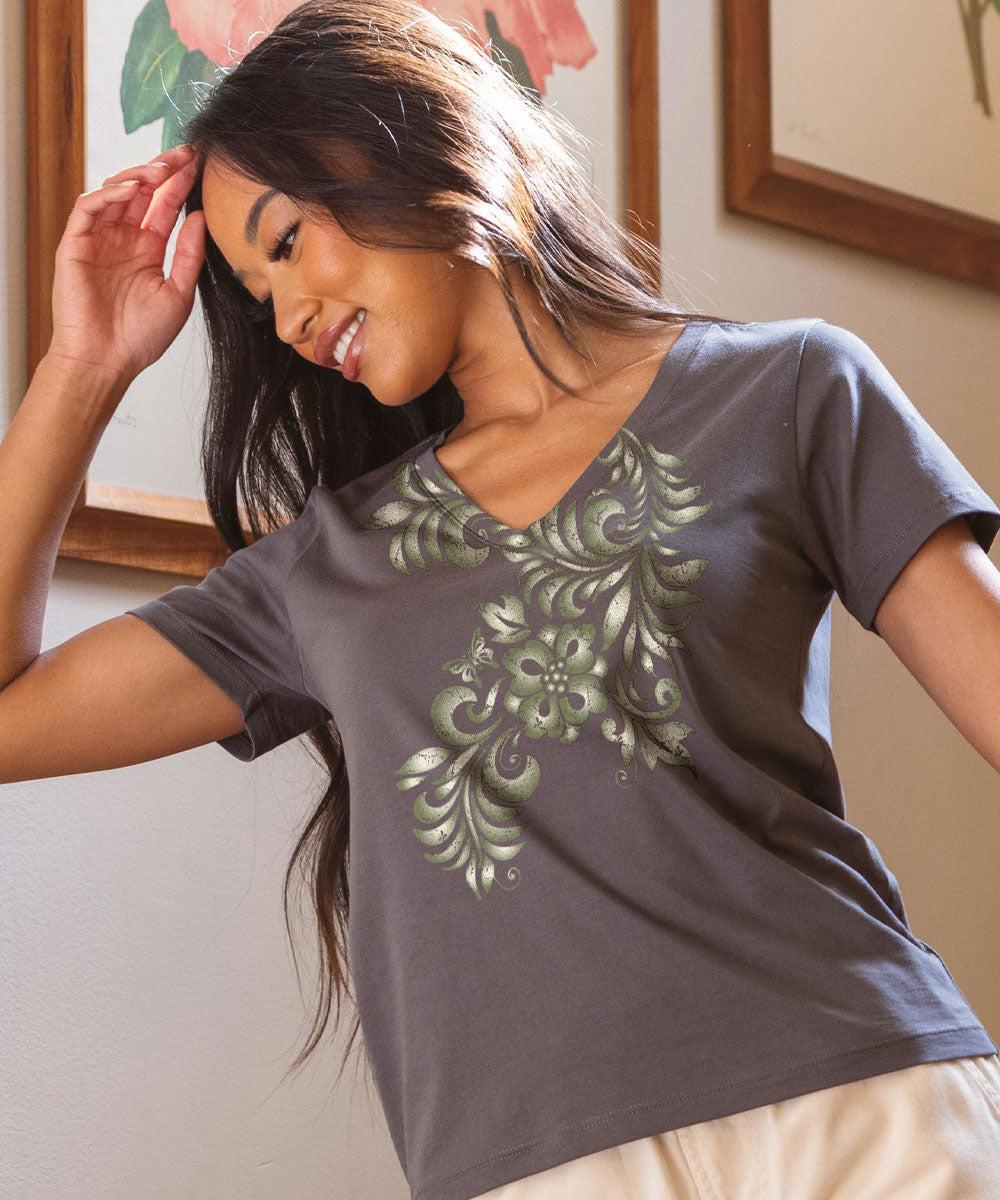 A woman wearing a gray short sleeve pima V-neck t-shirt with a floral design in green. View 2