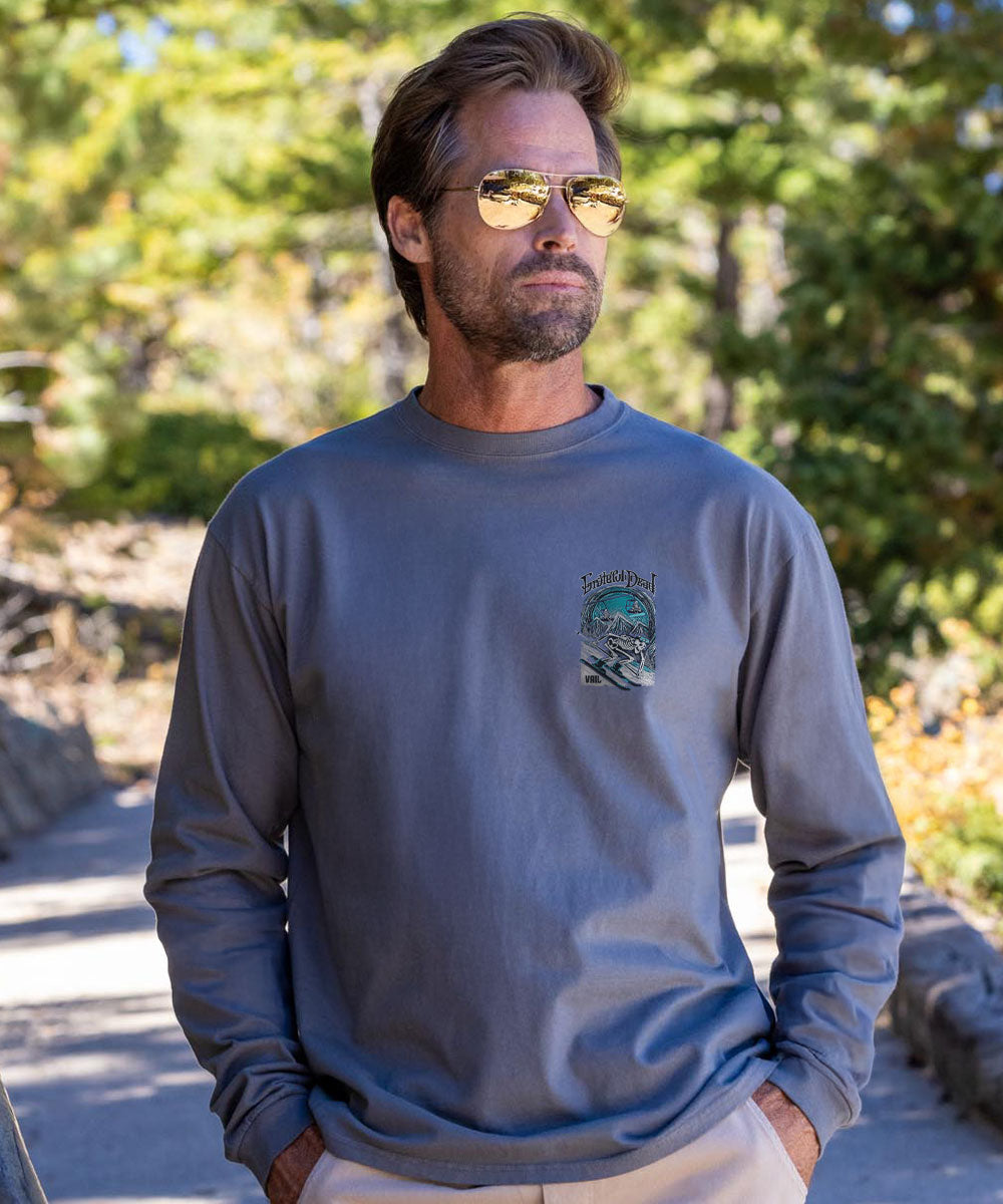 Man wearing a gray long-sleeve shirt with a graphic design outdoors View 3