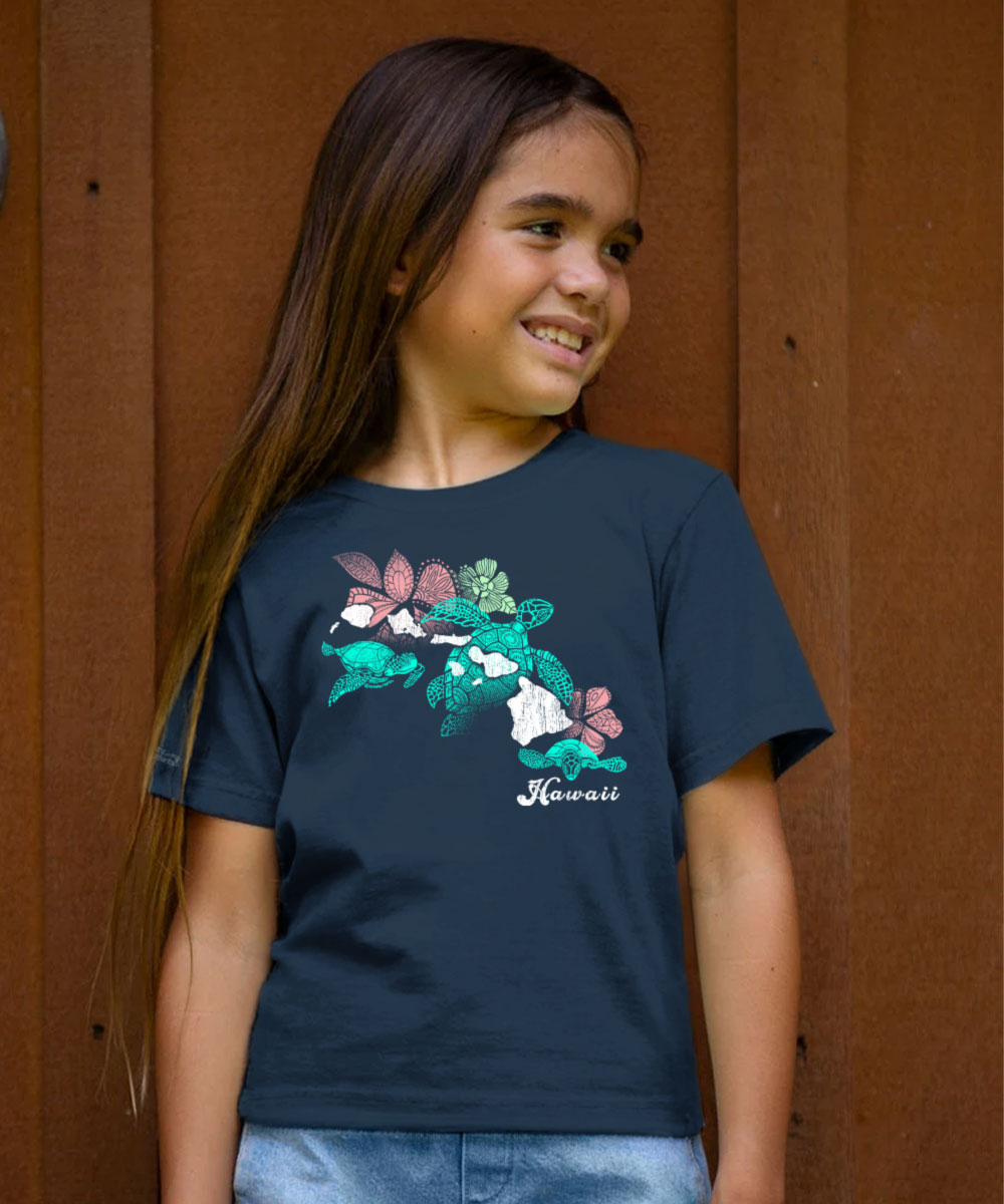 Young girl wearing a navy blue t-shirt with a colorful graphic design View 2