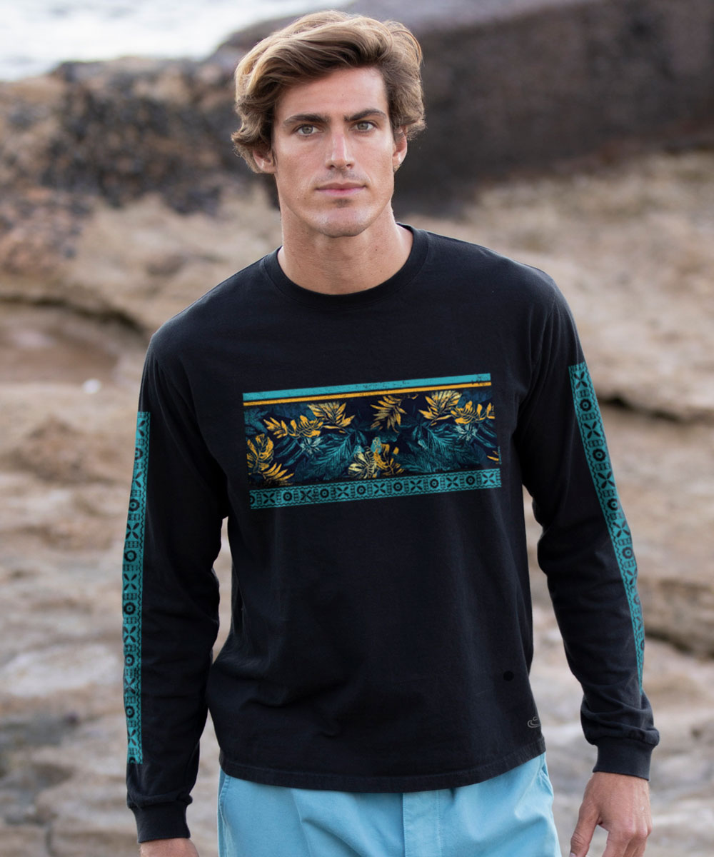 Man wearing a black long-sleeve shirt with floral leaf and geometric pattern design outdoors View 2