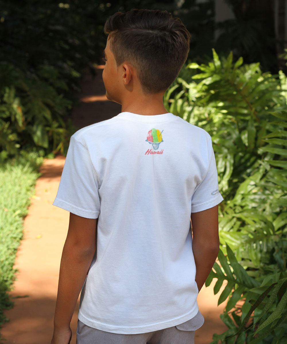 Child wearing a white t-shirt with a logo in a garden setting View 3
