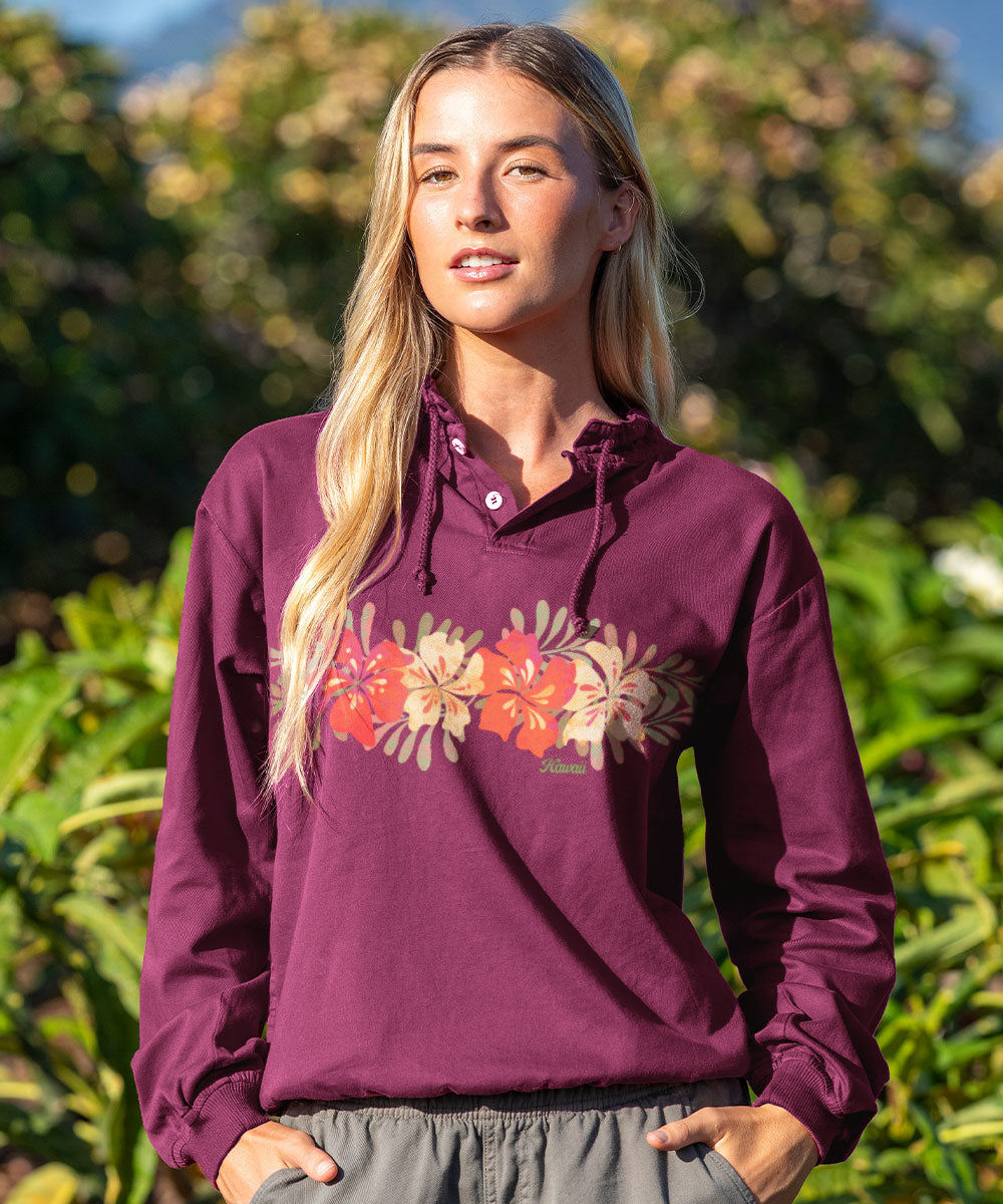 Woman wearing a purple hoodie with floral design outdoors View 2