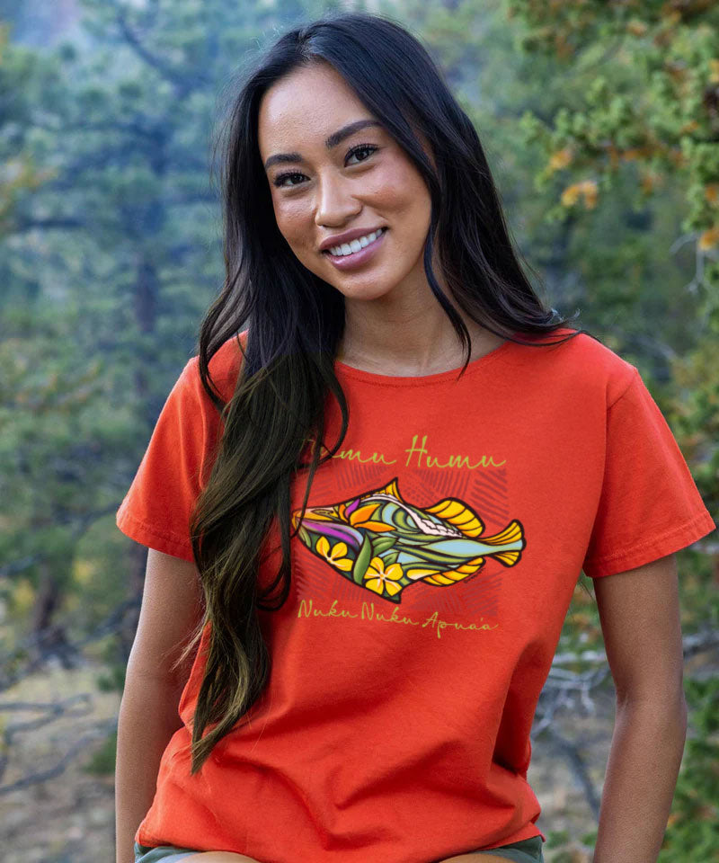 Woman wearing a red t-shirt with a colorful fish design outdoors View 2