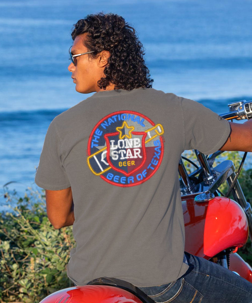 Person wearing a Gray Lone Star Beer t-shirt by the ocean View 2