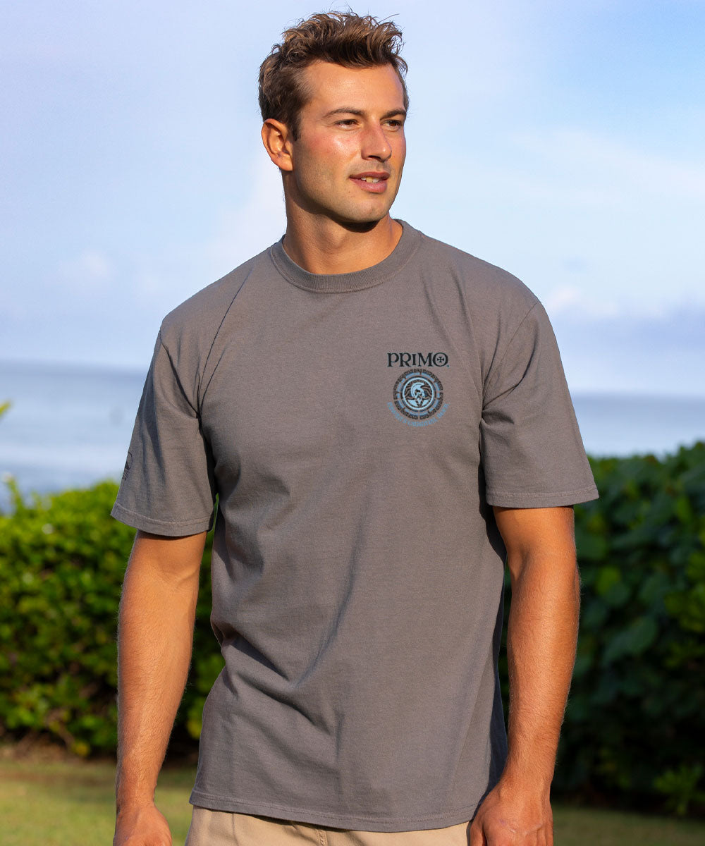 Man wearing a gray t-shirt with a logo outdoors View 3