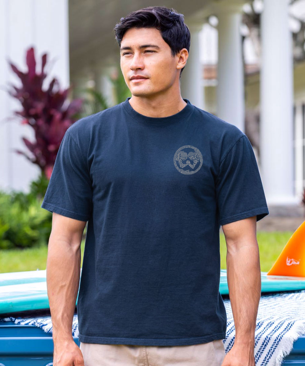 Man wearing a navy blue t-shirt with a logo outdoors View 3