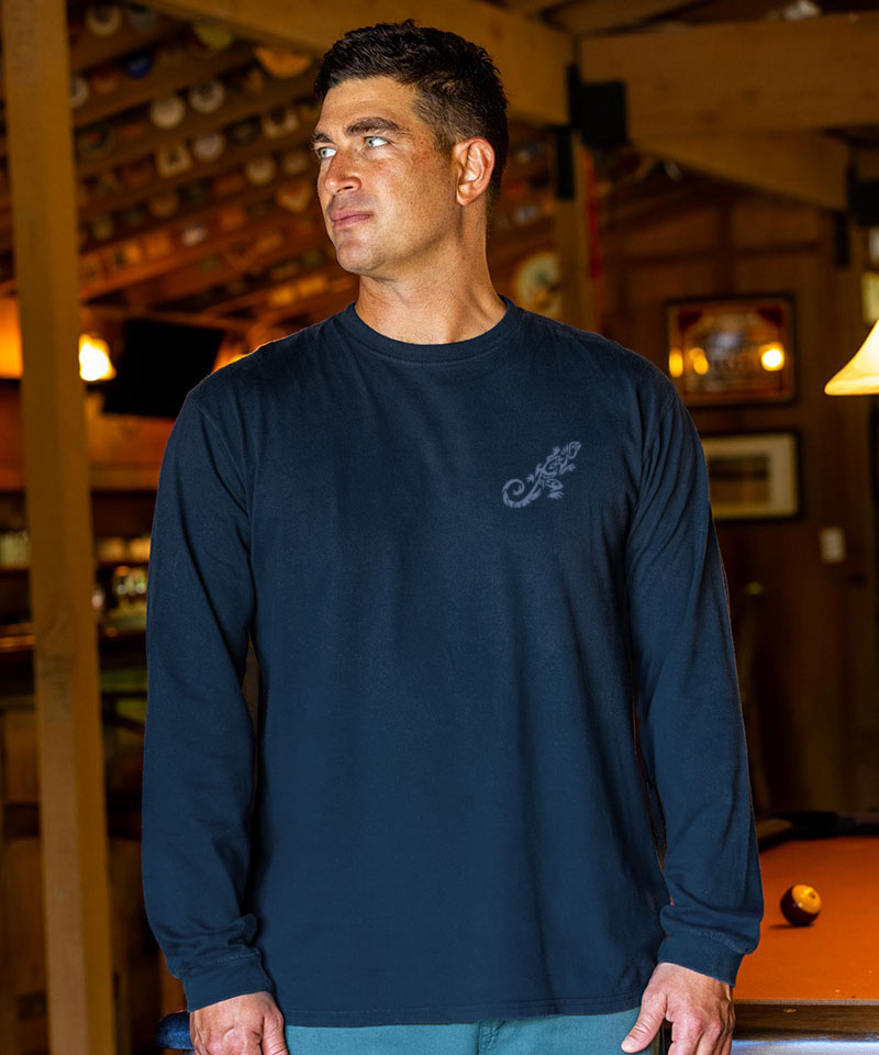 Man wearing a navy blue long-sleeve shirt with a logo in an indoor setting View 3