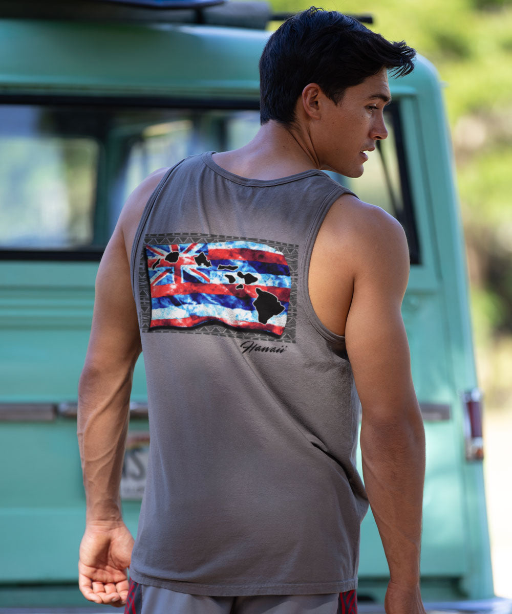 Person wearing a gray tank top with a colorful graphic on the back, standing in front of a vintage van. View 2