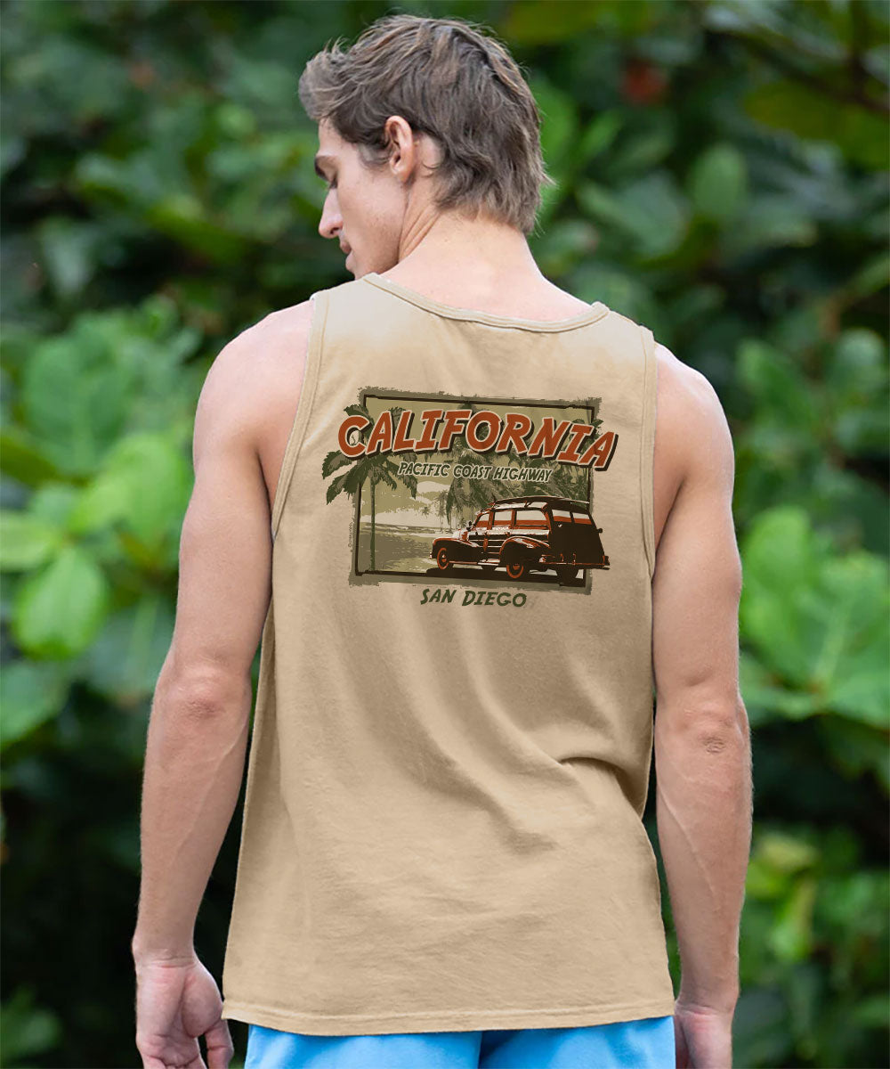 Person wearing a tan tank top with 'California' and 'San Diego' design, standing in front of green foliage. View 2