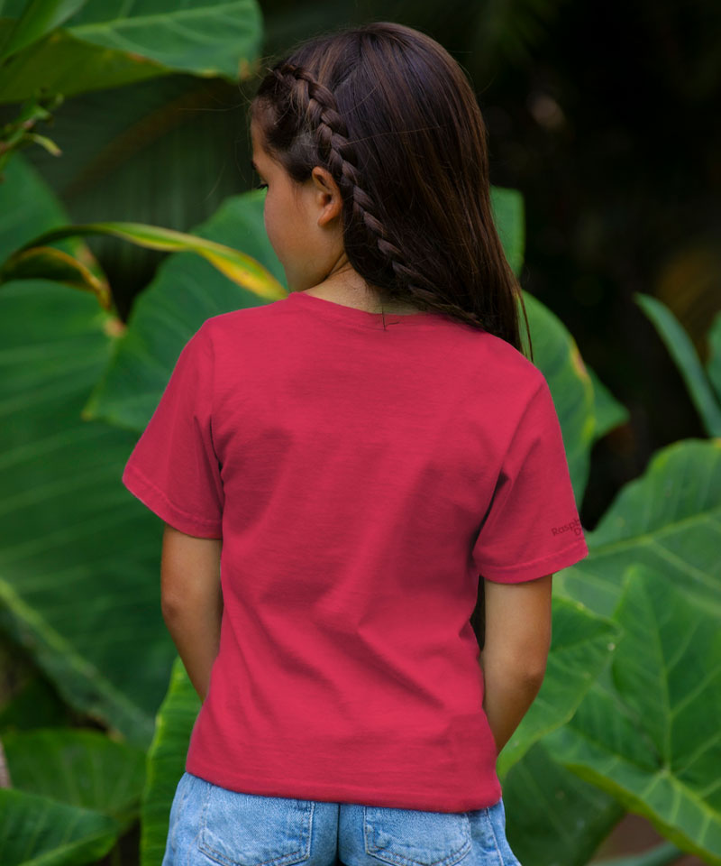 Person wearing a red shirt standing among large green leaves View 3