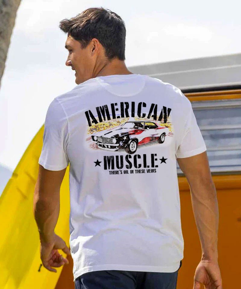Man wearing a white t-shirt with 'American Muscle' graphic design outdoors. View 2