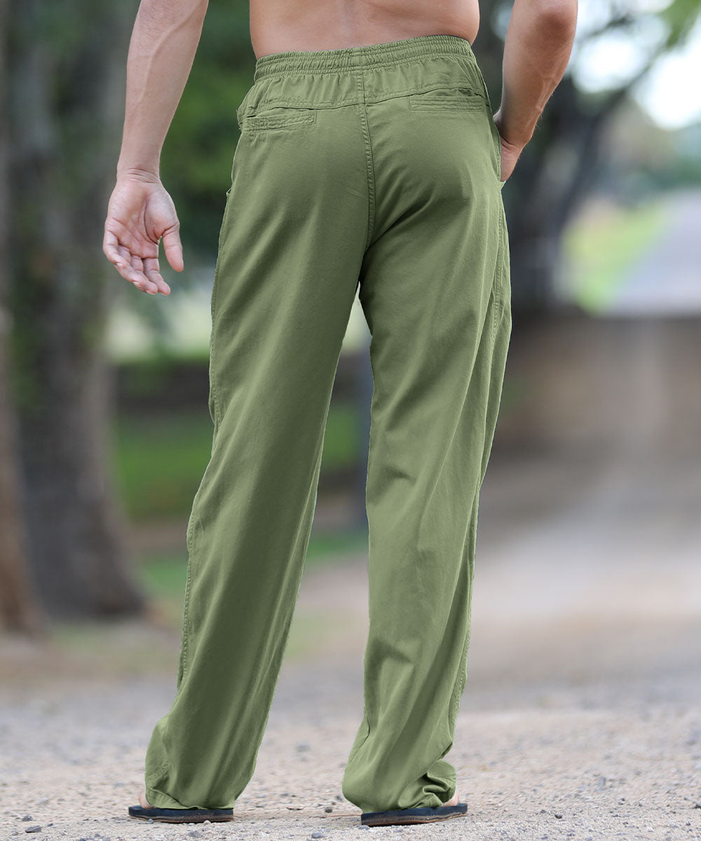 Person wearing green pants standing outdoors View 3
