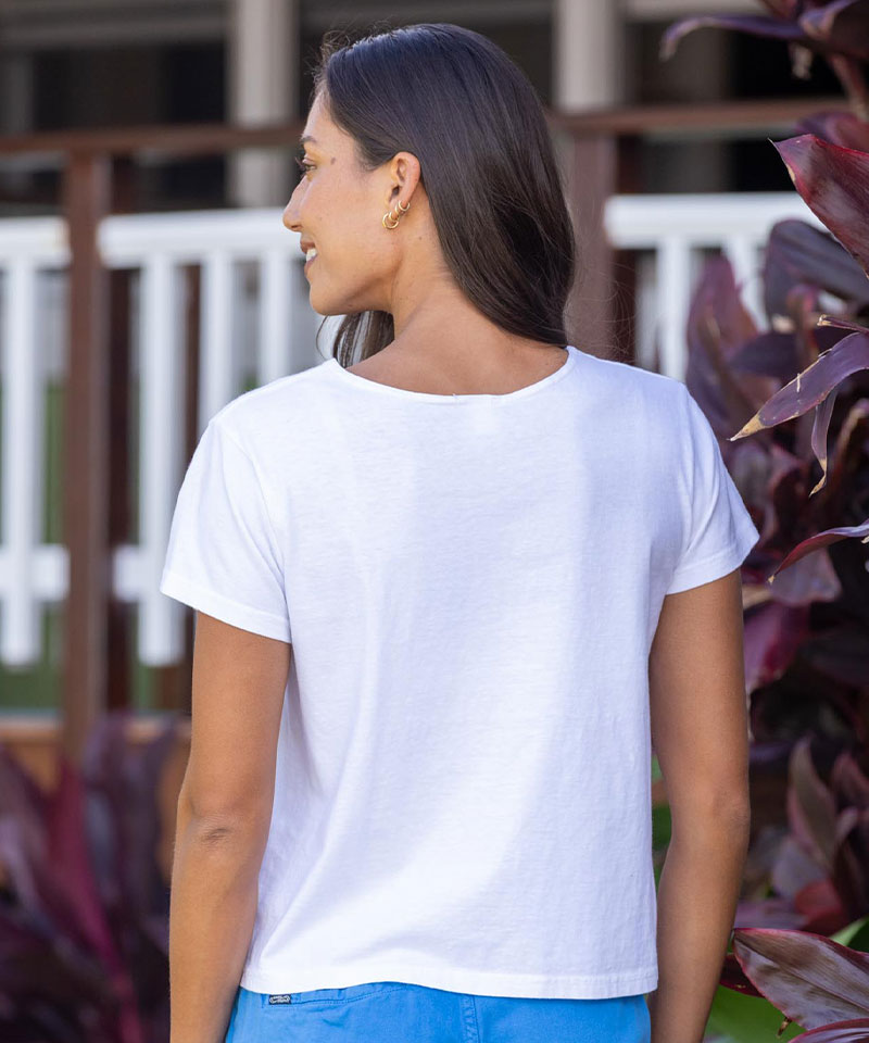 Woman wearing a white t-shirt with a blurred background View 3