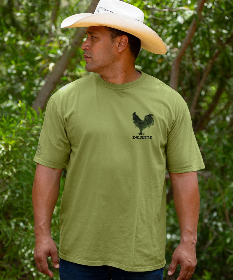 Man wearing a green t-shirt with a rooster logo outdoors View 3