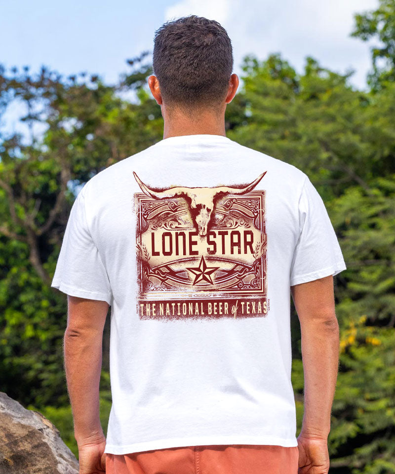 Person wearing a white t-shirt with 'Lone Star' design outdoors View 2