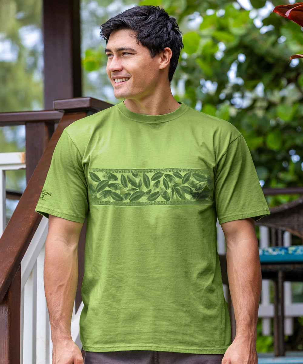 Man wearing a green t-shirt with leaf design outdoors View 2